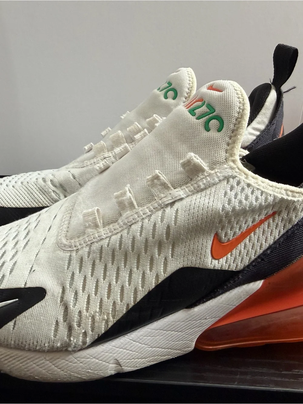 Nike Kids White Sneakers with Black, Orange and Green Accents
